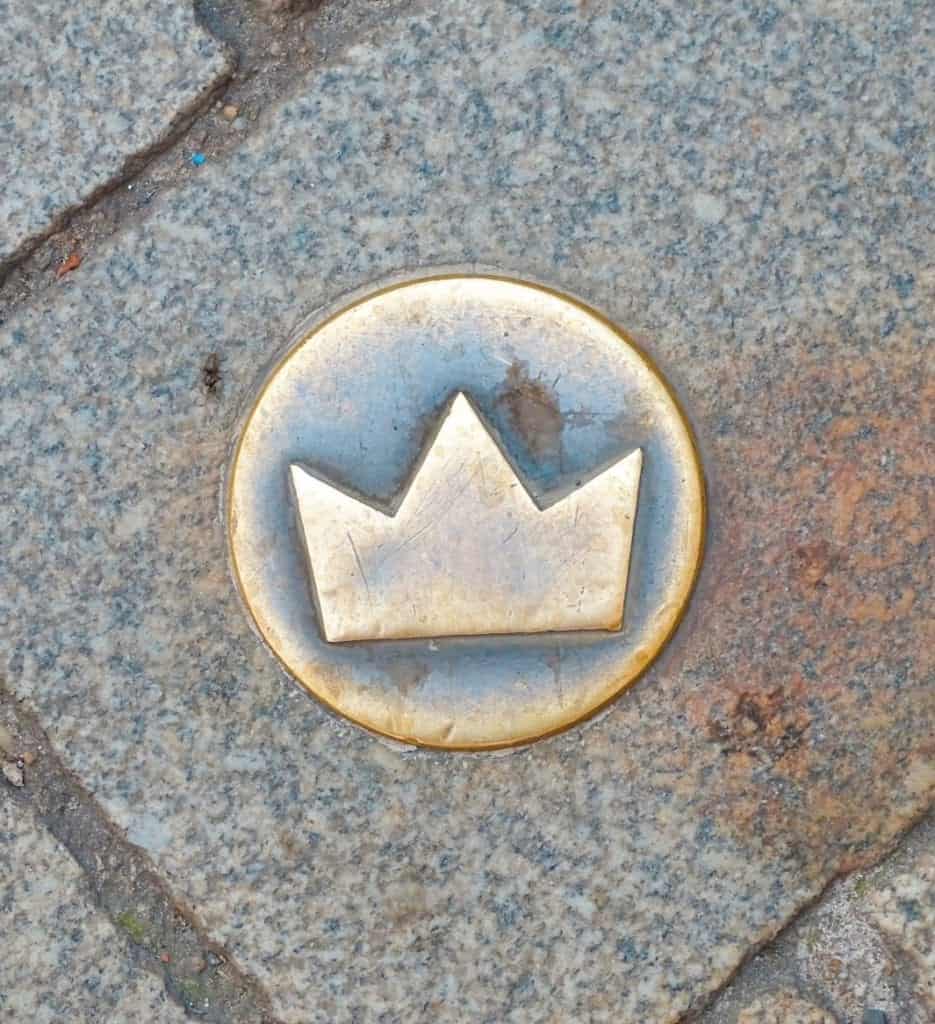 Gold crown on cobbled street Bratislava 
