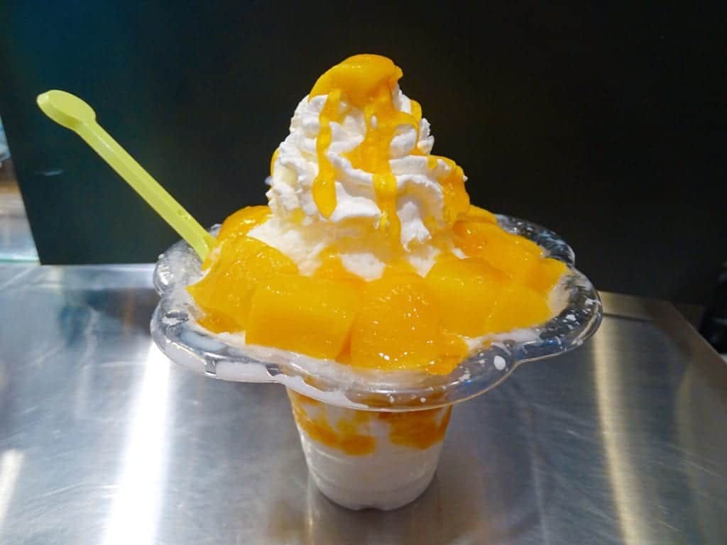 Mango bingsu with fruit and cream served at a street stall