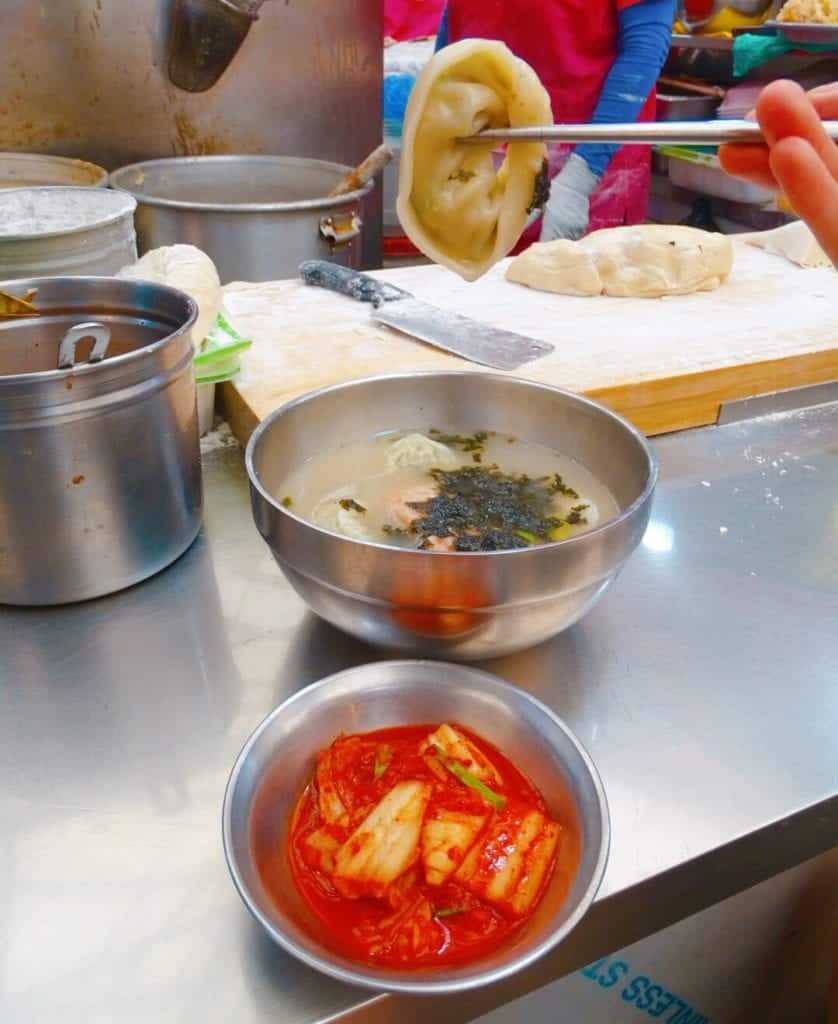 Dumplings and kimchi at Seoul street food market 