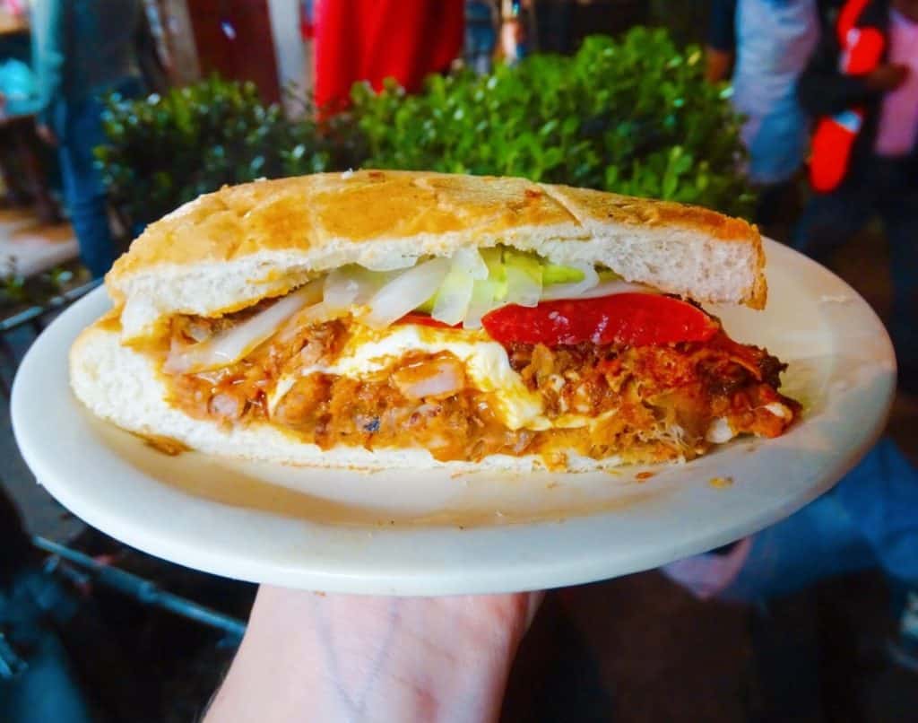 Mexican torta with pork and salad