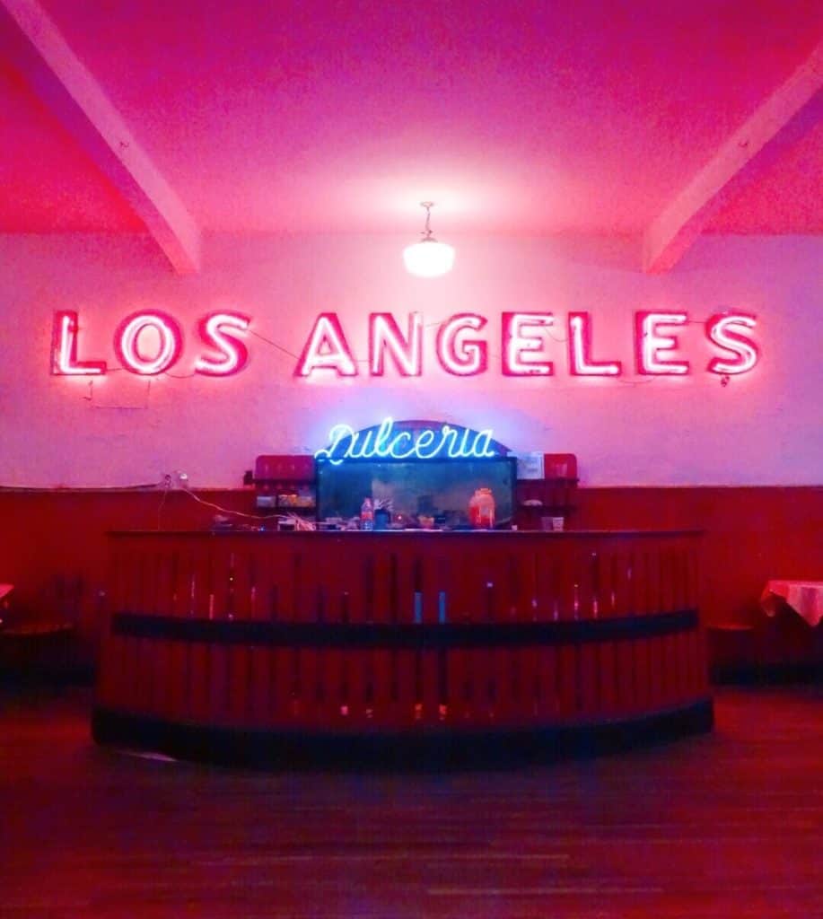 Pink sign saying Los Angeles in saloon in Mexico City