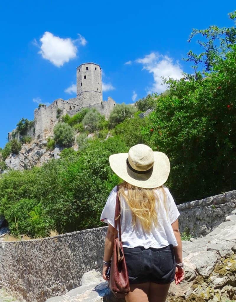 Girl looking over Pocitelj Castle
