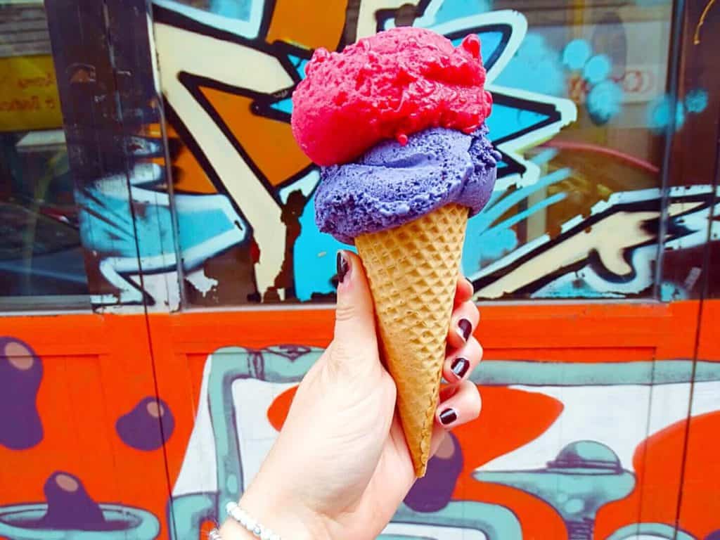 Ice cream cone with street art backdrop