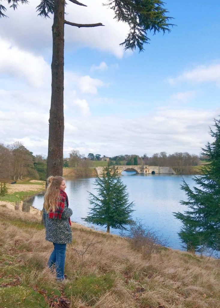 Girl beside tall tree in Blenheim Palace grounds