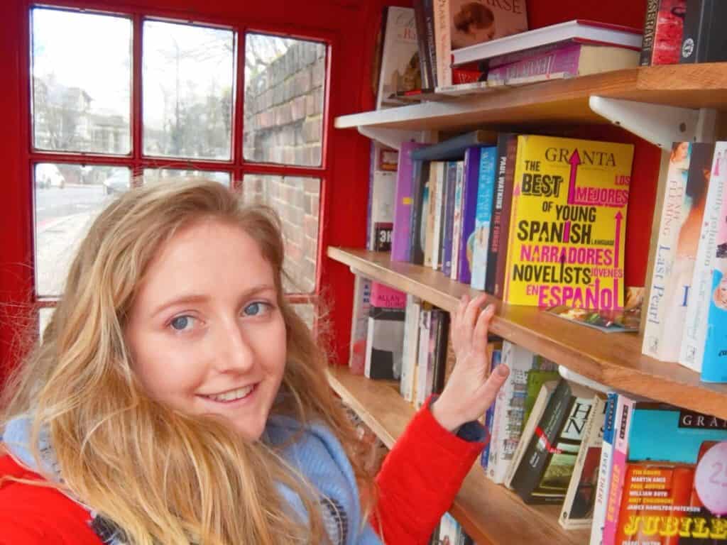 Girl browsing books inside Lewisham Micro Library 