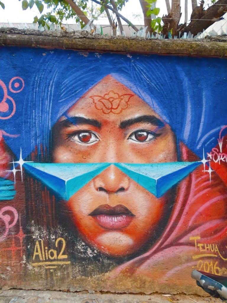 Street art showing a woman's face in Oaxaca