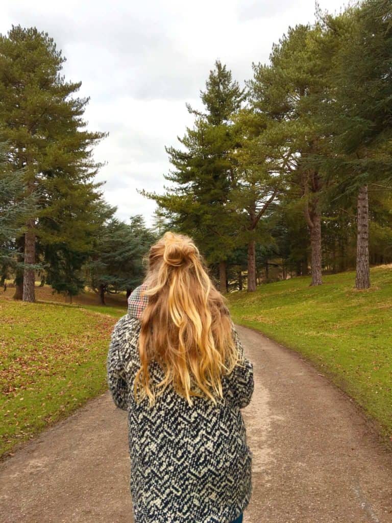 Girl walking down path in Blenheim Palace