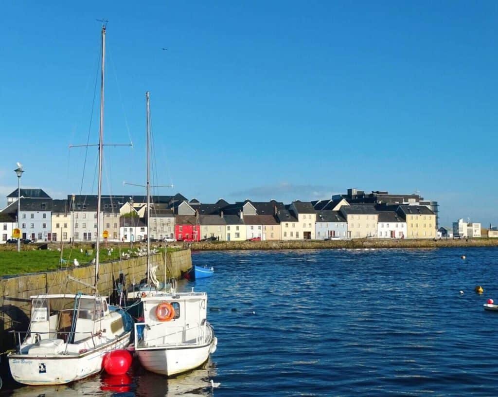 Boats and colourful houses Long Walk Galway