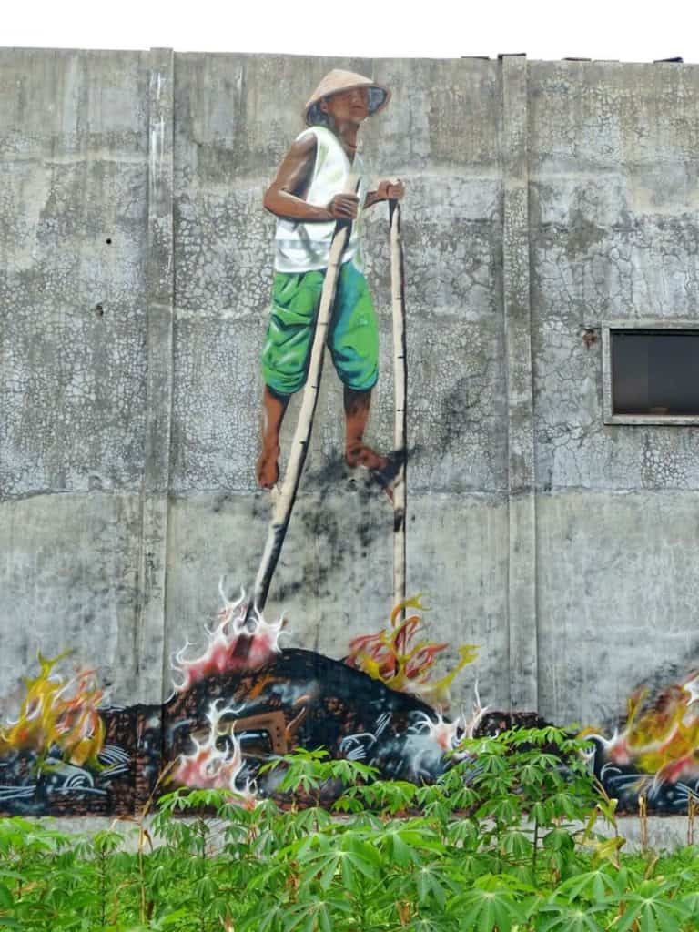 Street art of mans with trash Yogyakarta 