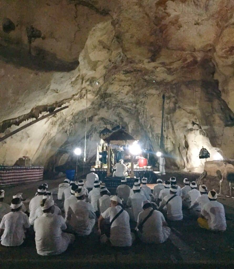 Prayer session at Goa Girl Putri Cave itinerary Nusa Penida