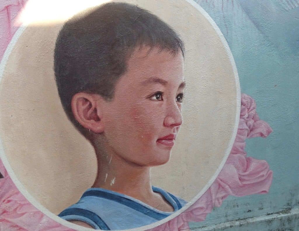 Young boy street art Tam Thanh Village hoi an