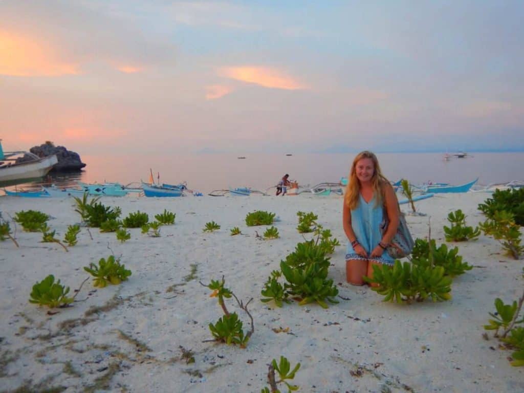Girl on beach Malapasqua island Philippines