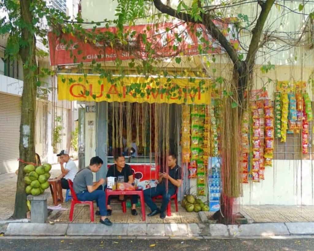 Men drinking coffee Truc Bach Hanoi