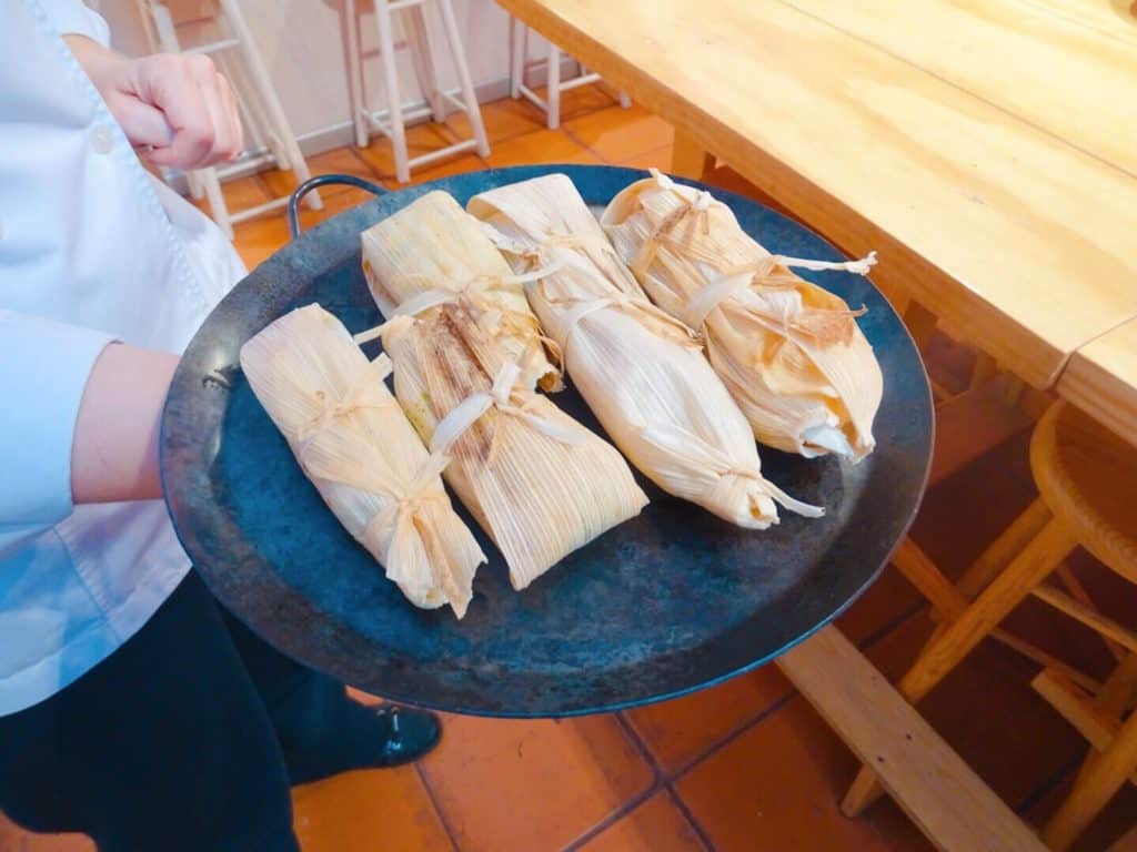 Four tamales on plate Aura Cocina Mexicana cooking class