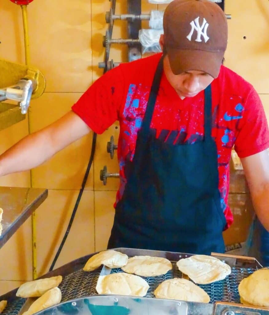 Fresh tortillas on machine Aura Cocina Mexicana cooking class