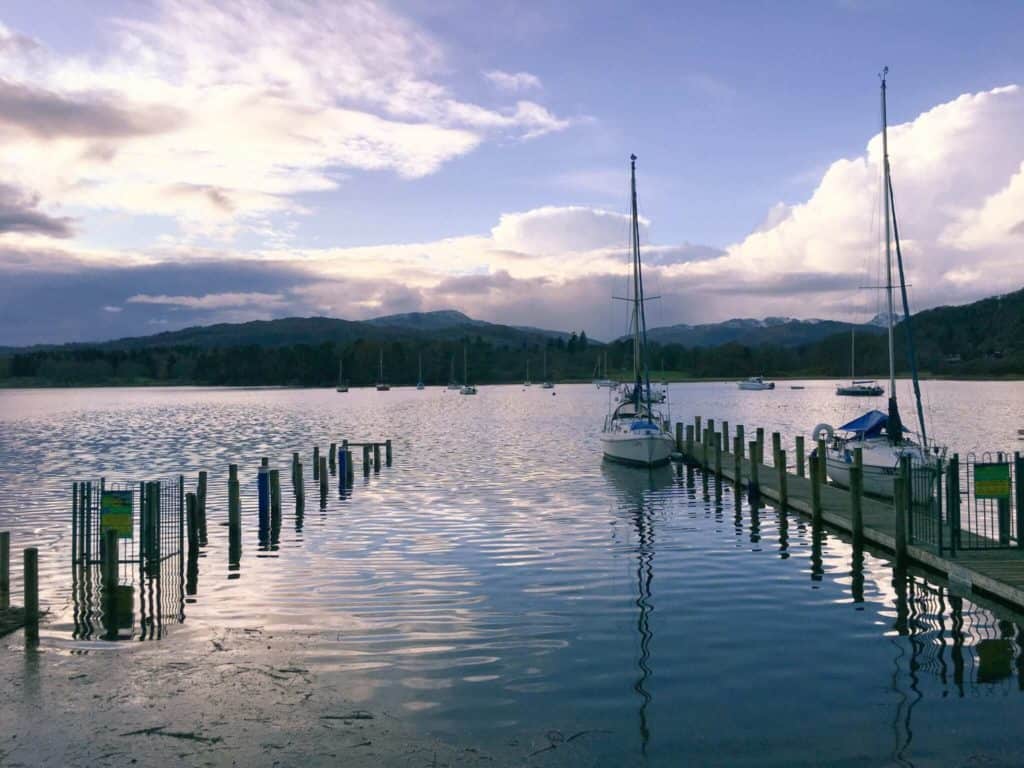 Two boats on Lake Windermere at sunset