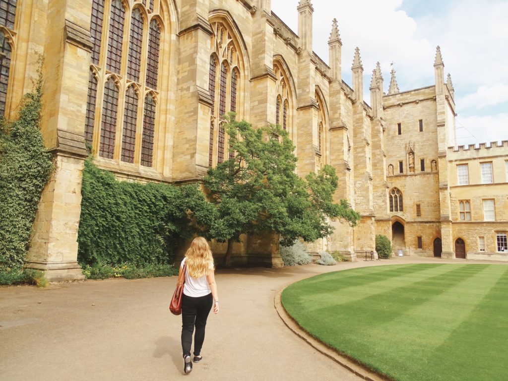 Girl walking through quad New College