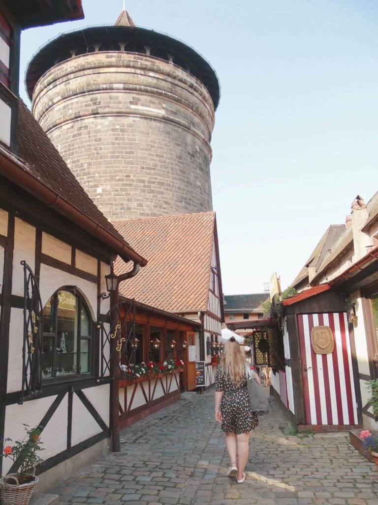 Girl walking through Handwerkerhof Market