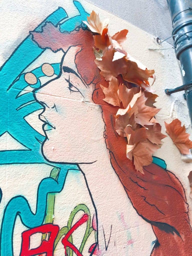 woman with leaf hair street art