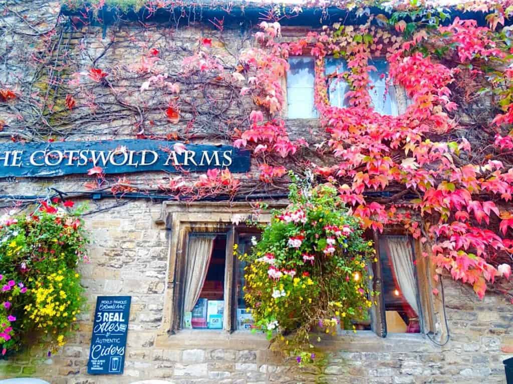 Red leaves growing up Cotswolds Arms things to do Burford