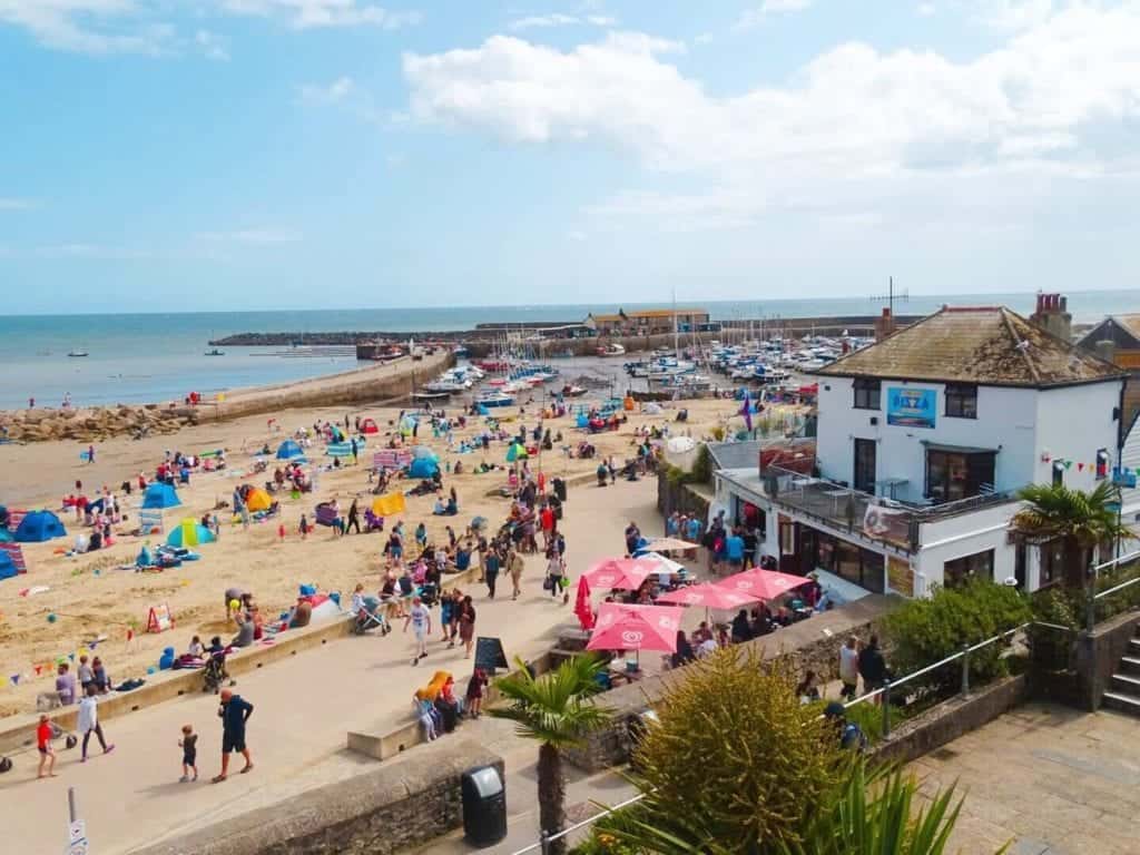 Busy Lyme Regis Beach weekend in Dorset 