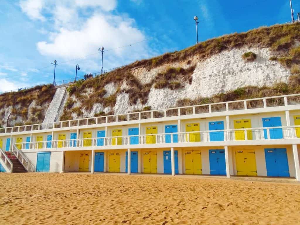 blue and yellow beach huts Kent