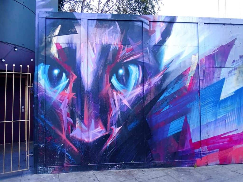 Purple cat street art Camden