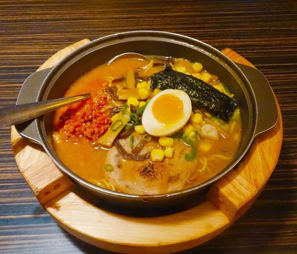 Bowl of ramen topped with seaweed and a boiled egg
