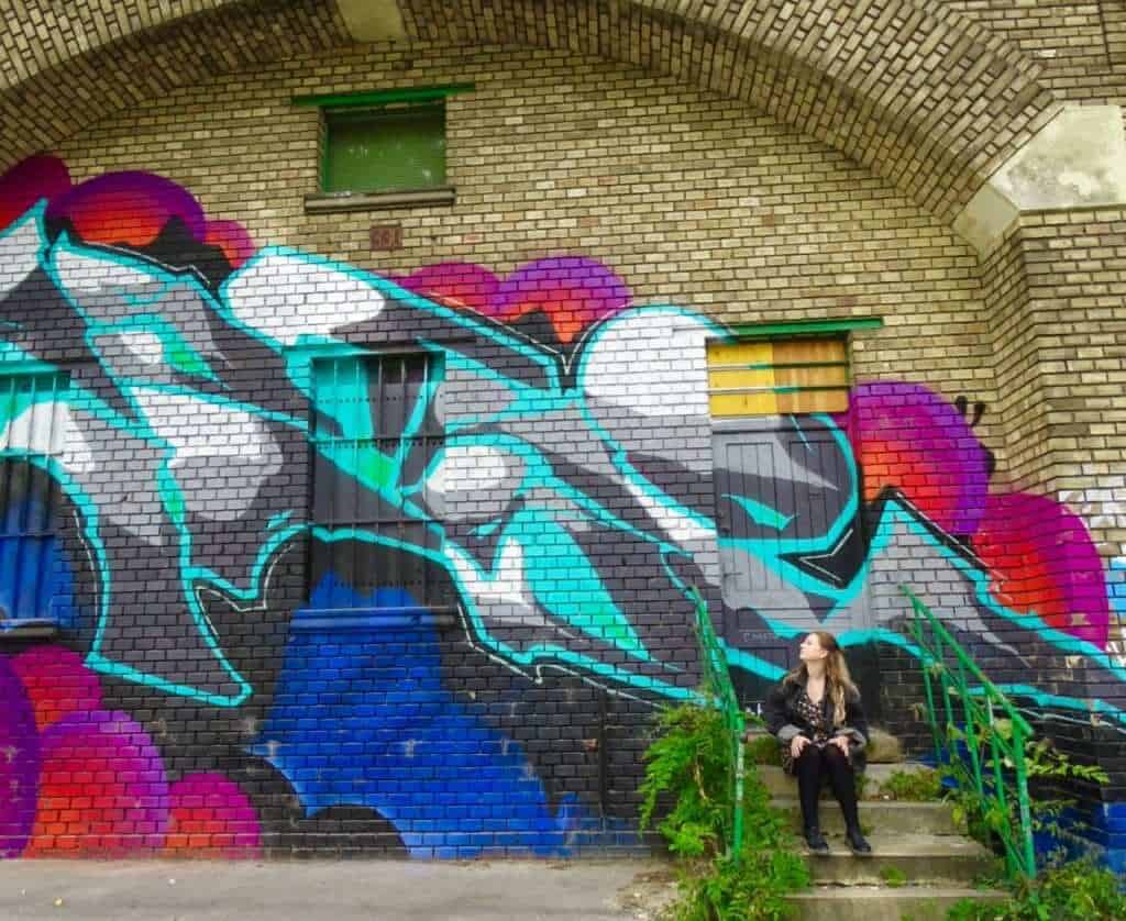 Girl and colourful mural