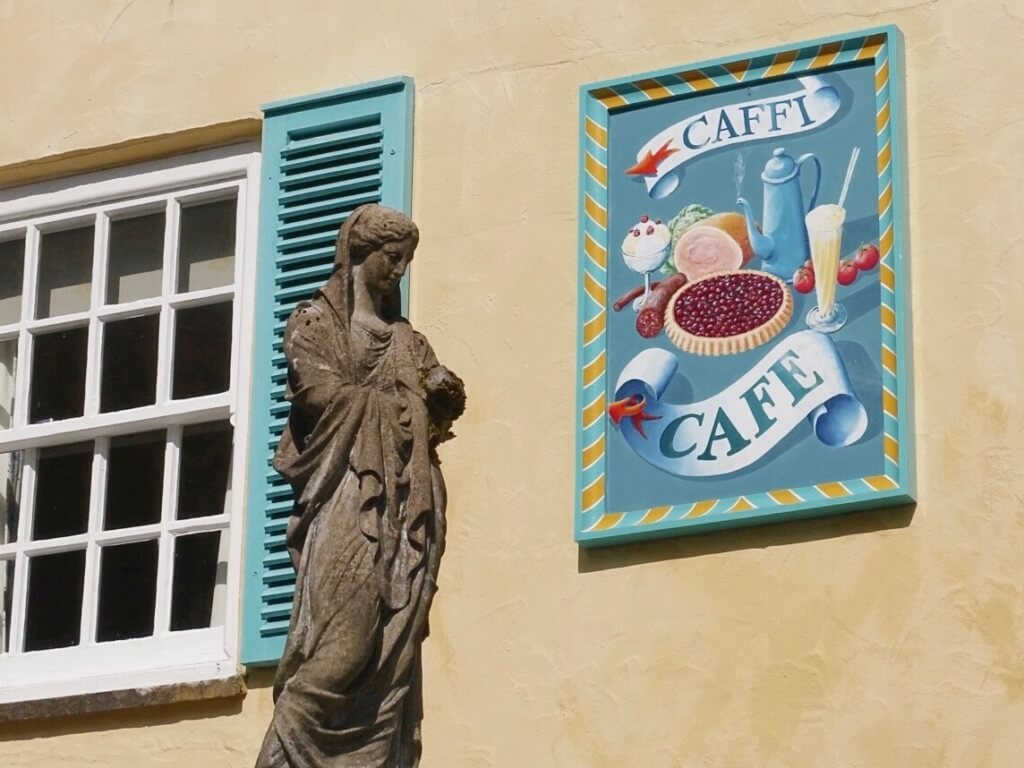 Cafe sign and statue