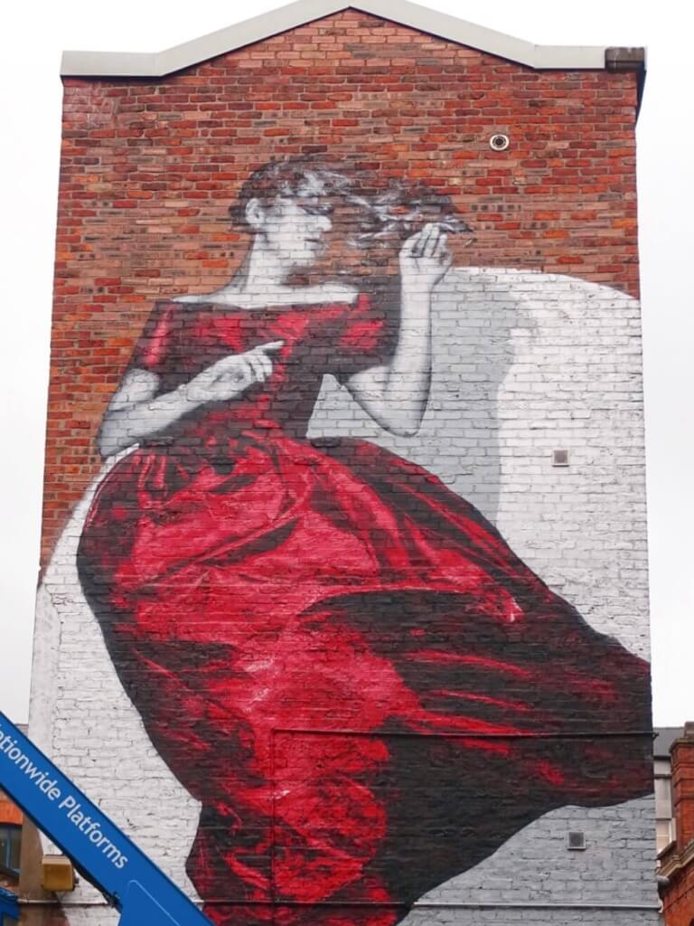 Women in red dress mural manchester