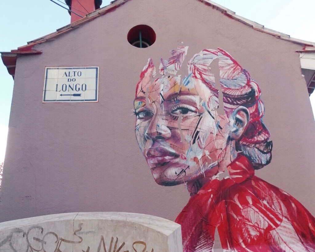 Pink woman street art Barrio Alto 