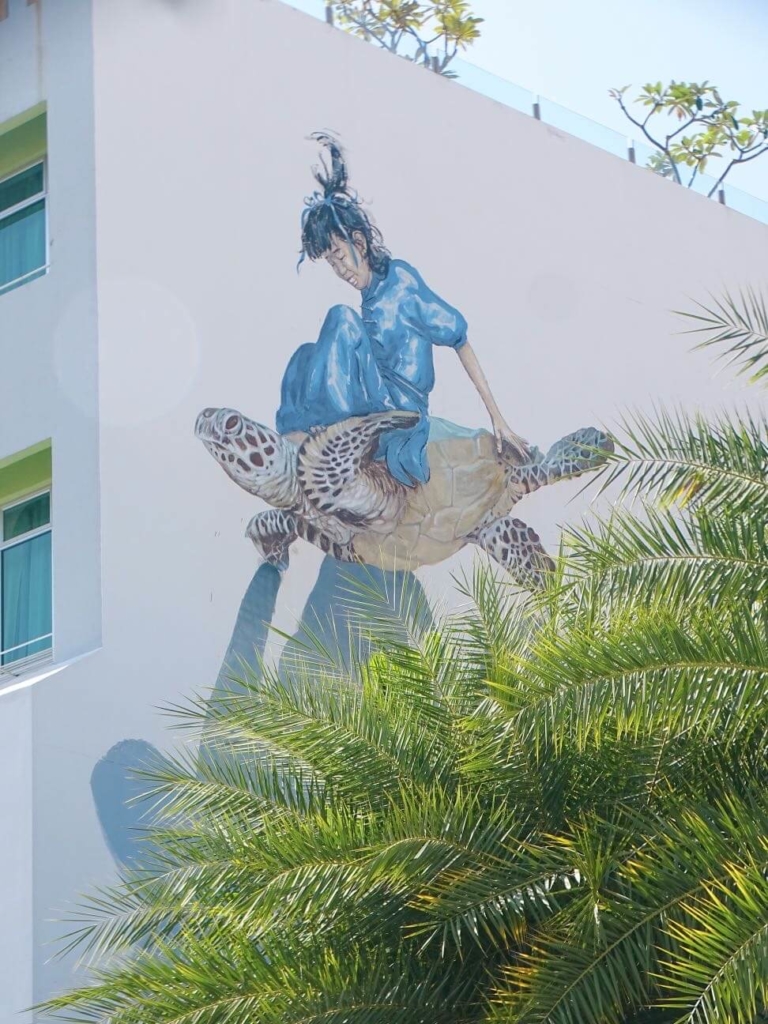 girl on turtle street art penang